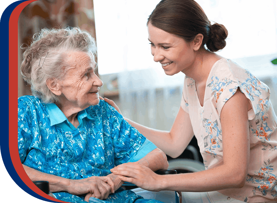 Young woman giving an elderly woman a friendly greeting